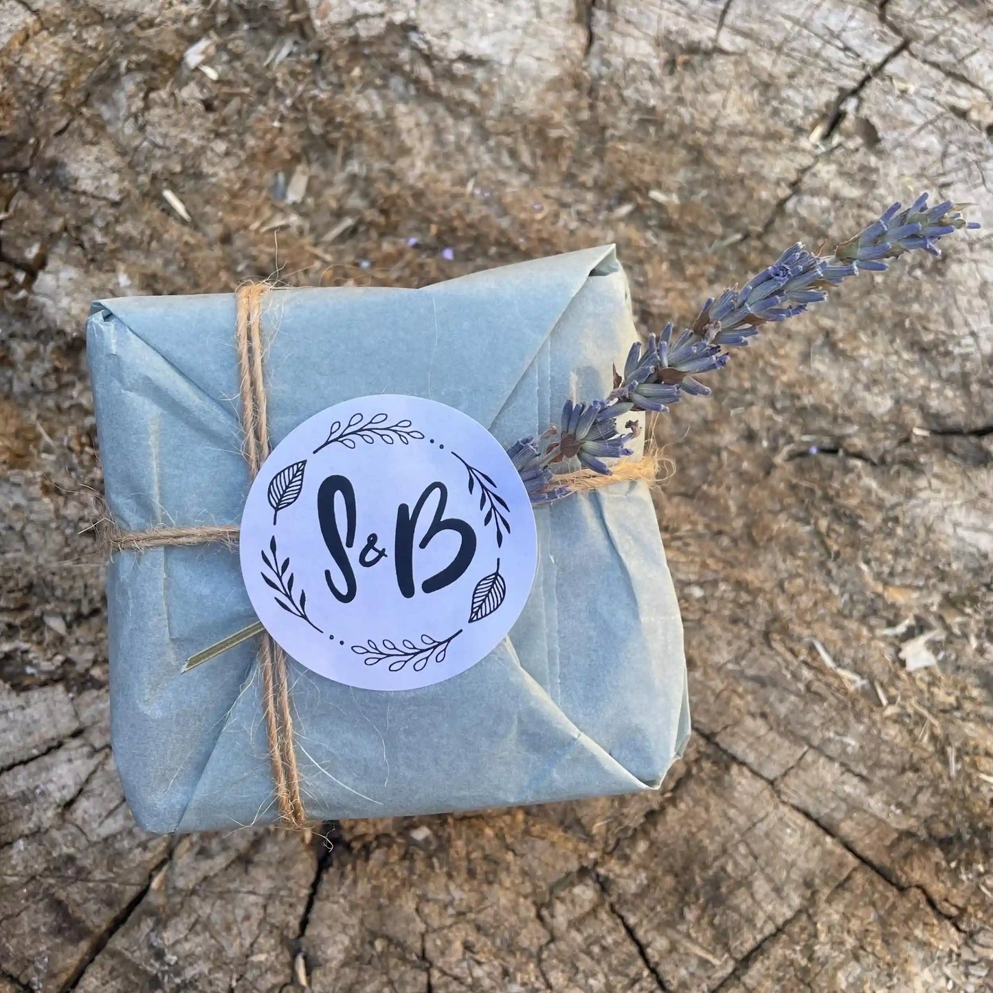 The Dark Forest men's natural soap, gift-wrapped in eco-friendly paper with twine and a sprig of lavender.