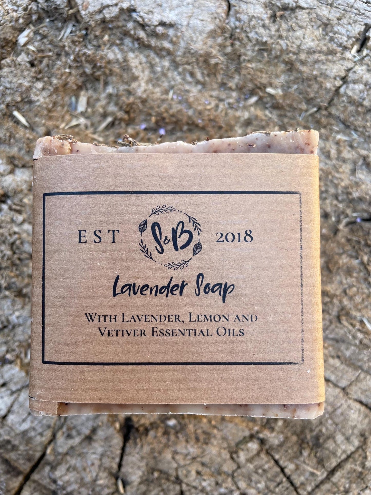 Close-up of the eco-friendly kraft paper packaging for the Soapy & Bubbly Handmade Lavender, Lemon and Vetiver Essential Oil Soap.