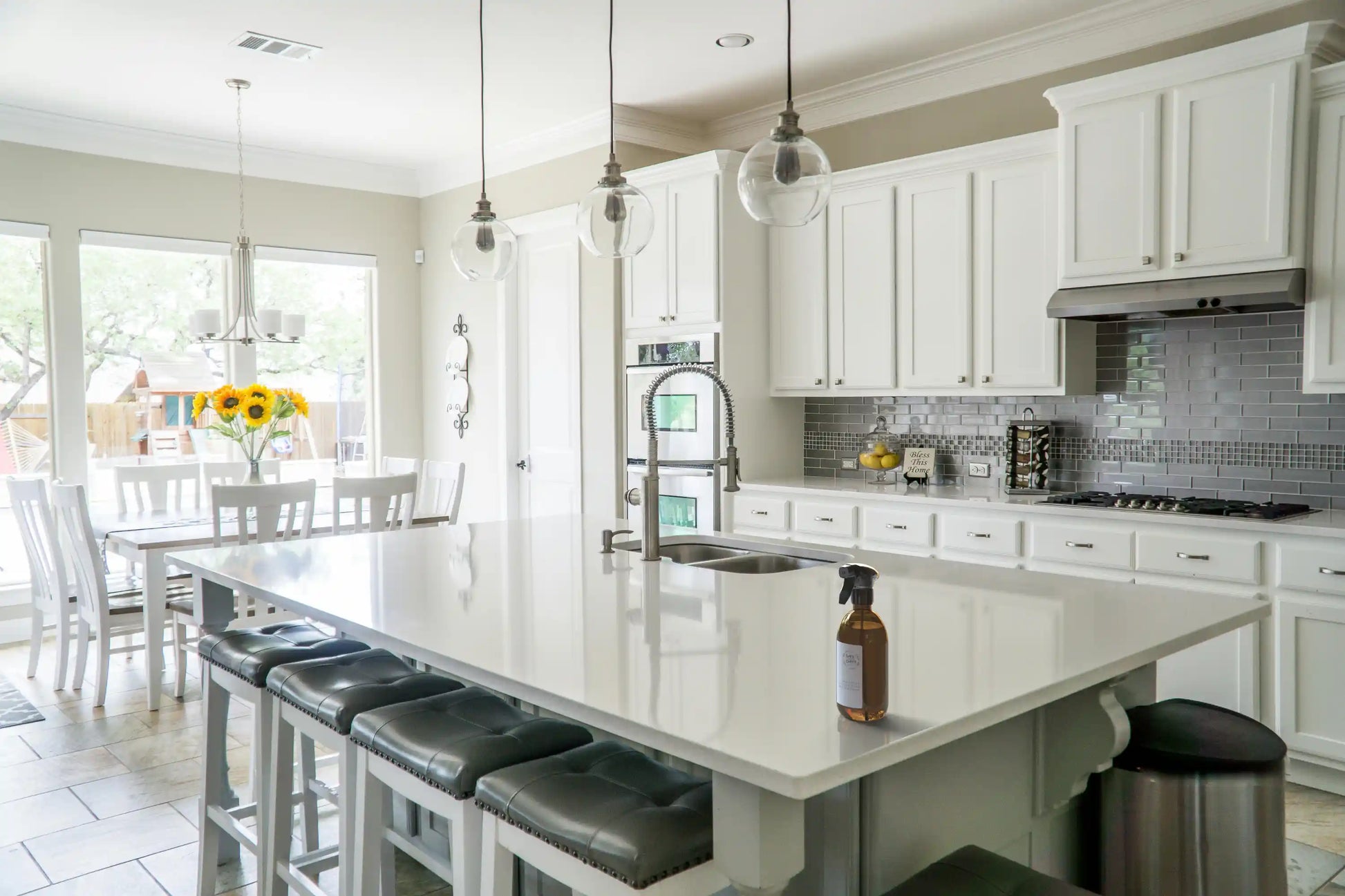 Amber glass spray bottle filled with homemade natural surface cleaner, made with the Soapy & Bubbly recipe concentrate on a clean countertop