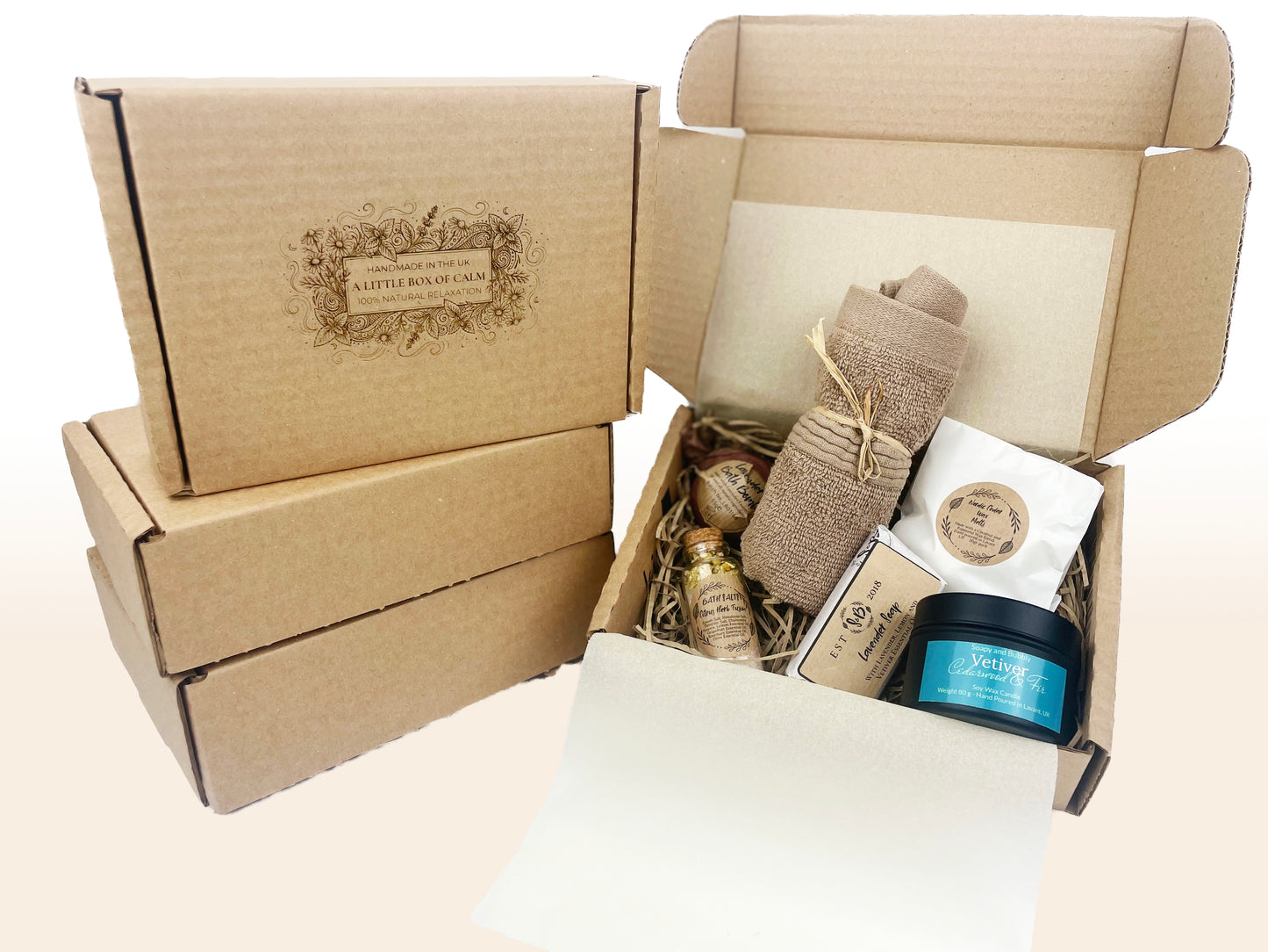 A little box of calm stress relief care package along with the open box of self-care products