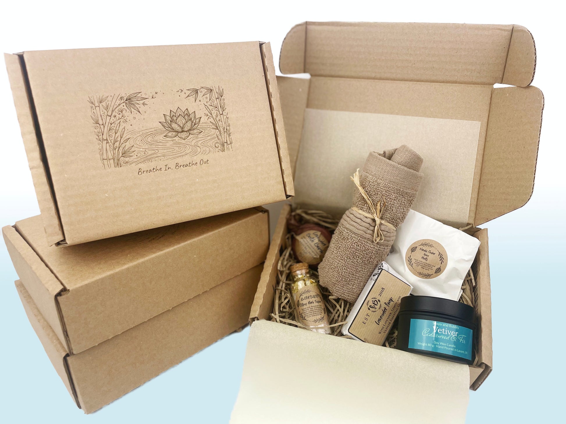 Breathe in breathe out mindfulness gift box with lotus flower design near the box with self-care products