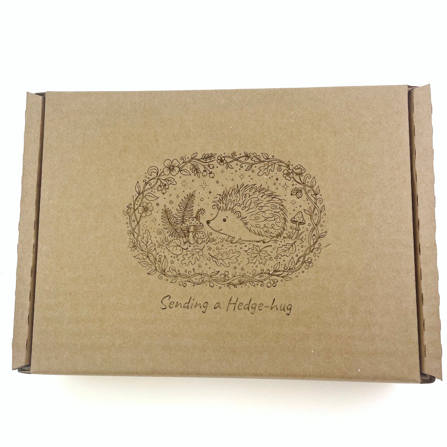 Laser etched gift box with cute hedgehog illustration sending a hedge-hug