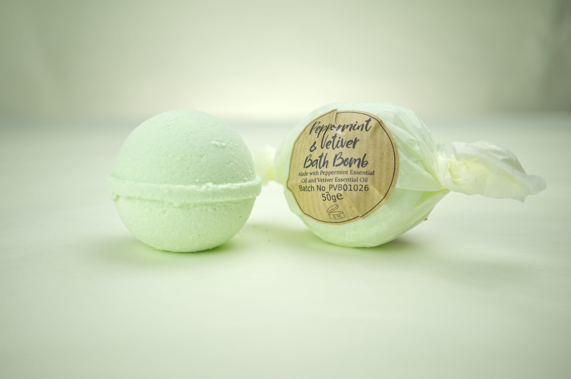Bath bomb with peppermint and vetiver essential oils.