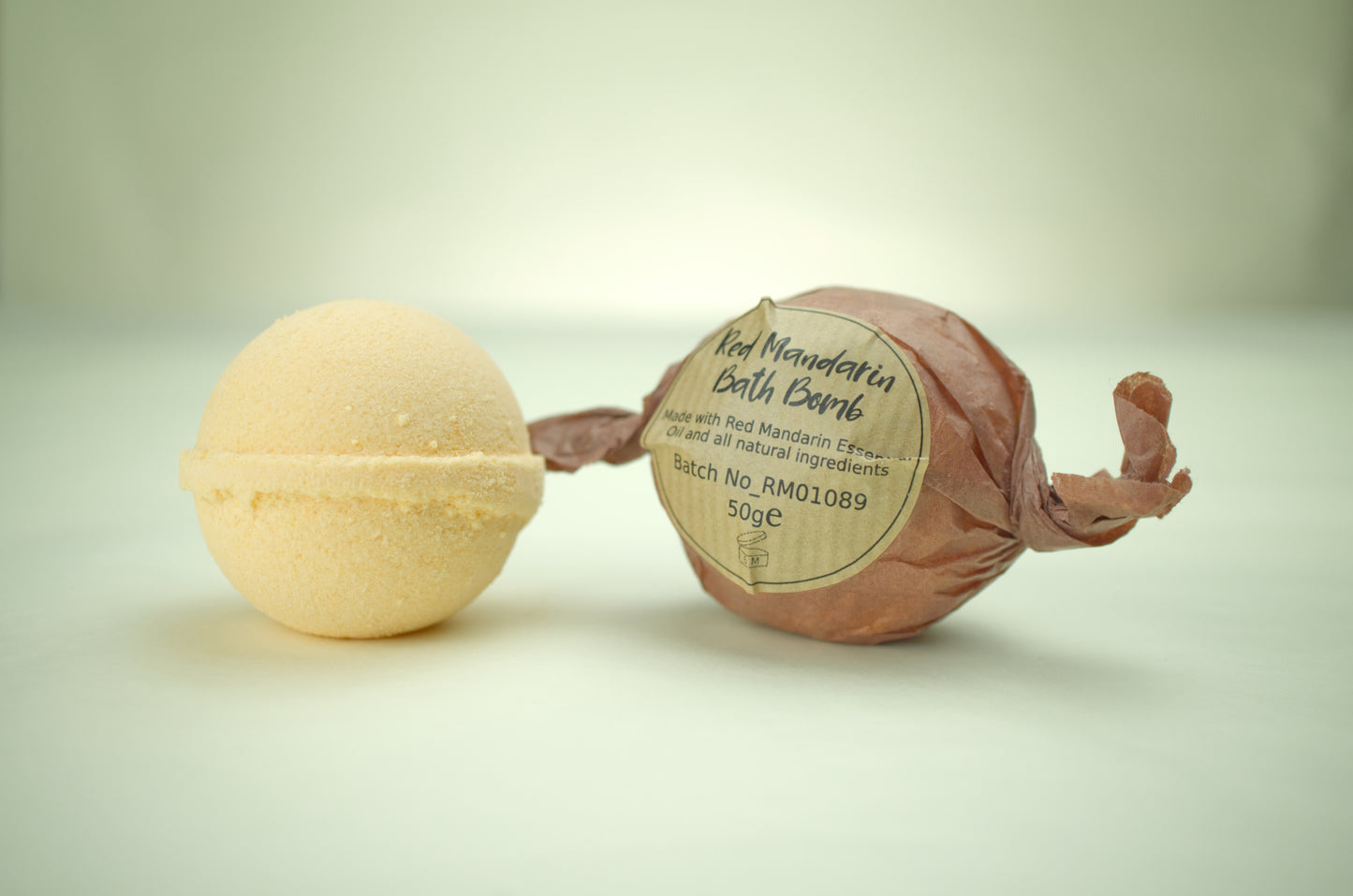 Fizzy bath bomb with red mandarin essential oil and natural ingredients